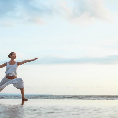 Young woman doing yoga outdoors